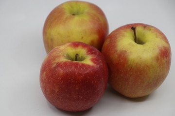Red apples in white background