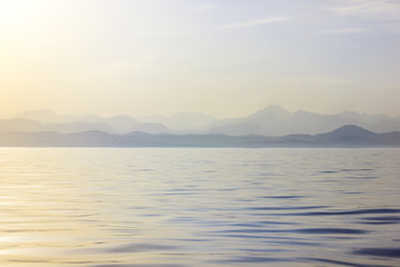 Calm sea in the morning. Waves of the ocean at dawn.