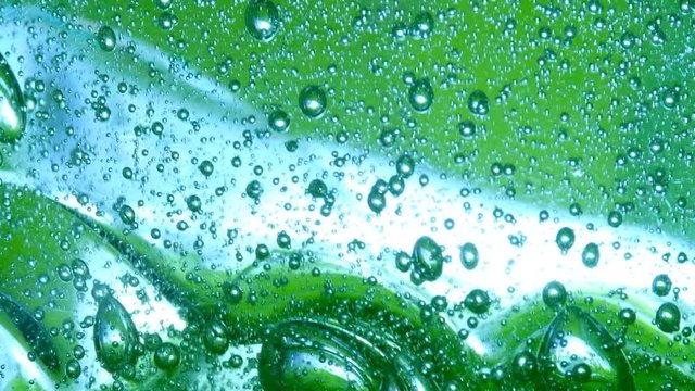Bubbles on green background horizontal seamless pattern. Circle and liquid, light design, clear soapy shiny.slow motion