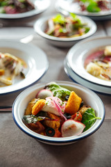 Closeup on salad with radish fried cheese crackers