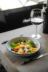 Breakfast fried eggs with shrimps glass of water