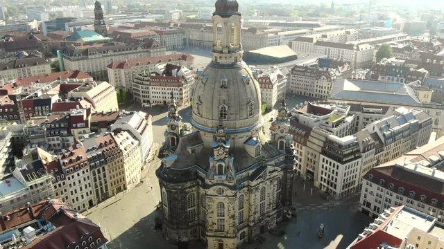 Aerial view of baroque church "Frauenkirche" in the beautiful evening sun. Drone view over the historical city Dresden, Germany. 