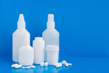 Plastic packaging medicine bottles for cosmetics vitamins pills or capsules. A container mock-up of an object to illustrate a drug pill.