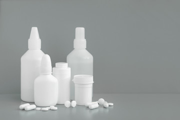 Plastic packaging medicine bottles for cosmetics vitamins pills or capsules. A container mock-up of an object to illustrate a drug pill.