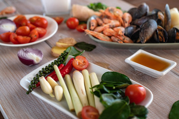 Cooking tom yam soup at home. Ingredients for Thai Tom Kung Soup. Thailand meal. Healthy food. Exotic food. Traditional dinner. Top view.