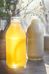 bottled honey and milk at sunset