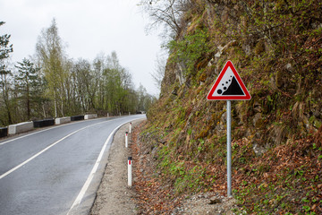 Warning road sign "rockfall collapsed"