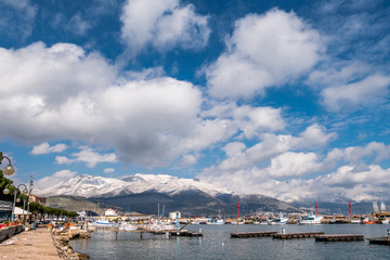 Sea landscape of Gaeta with cloudy sky and snowy mountains on background. Gaeta is a small medieval town in lower Lazio, Italy