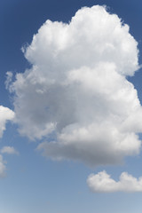 Blue background and huge clouds fluttering in the sky