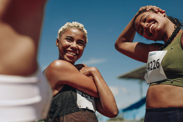 Female runners stretching before the race