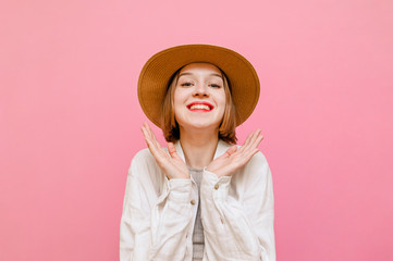 Portrait of joyful lady with happy face and clenched fists cheers, looks at camera and smiles. Cute...