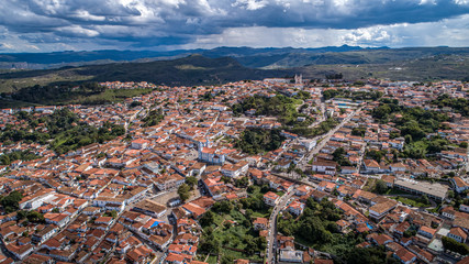 Aerial view in sunshine and dramatic clouds of the historic town Diamantina, Minas Gerais, Brazil
