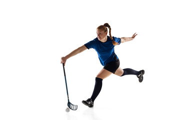 Fototapeta na wymiar Floorball female player isolated on white studio background. Action and motion, movement, healthy lifestyle and overcoming concept. Young caucasian woman in sportwear training, practicing the game.