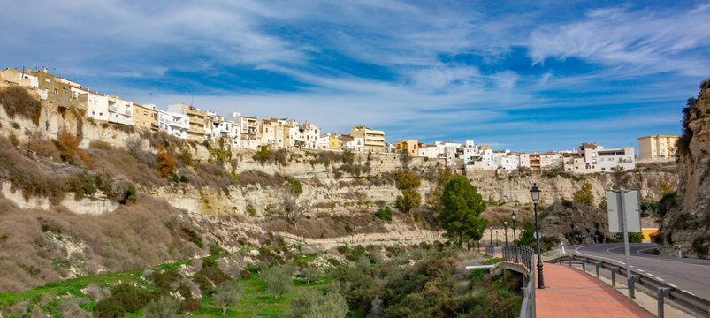 Residential buildings on the edge of high rock in Sorbas, Almeria, Andalusia.