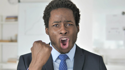 Angry African Businessman Yelling in Office