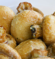 Sauteed mushrooms with garlic and parsley served during catering event.