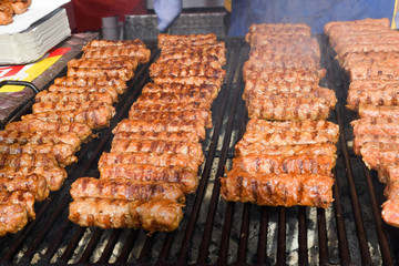 Chef grilling meat during cookout picnic or food event. Meat mix variety, Labour Day, 1 Mai