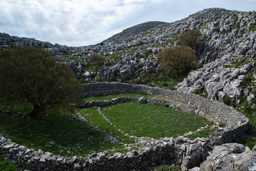 Fototapeta na wymiar Traditional sheep stone houses, archeological place at mountains near Mani near Areopoli, Peleponnes, Greece