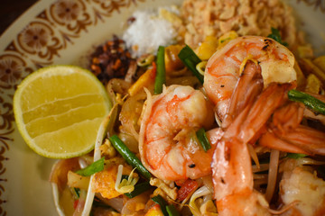 Thai Stir-fried rice noodles (Pad Thai) with shrimp and vegetables. One of the most famous food in Thailand. Thailand traditional dish.