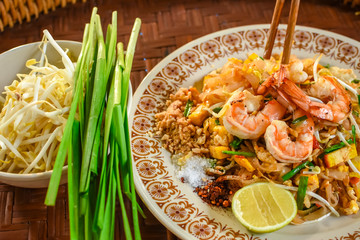 Thai Stir-fried rice noodles (Pad Thai) with shrimp and vegetables. One of the most famous food in Thailand. Thailand traditional dish. © Pornthep
