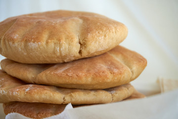 A stack of pita bread on a white background - fresh baked gluten-free pita bread 