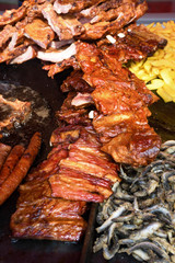 Chef grilling meat during cookout picnic or food event. Meat mix variety, Labour Day, 1 Mai