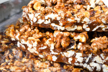 Granola bar in a bowl for sale. Healthy sweet dessert snack. Cereal granola bar with nuts