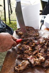 Obraz premium Chef grilling meat during cookout picnic or food event. Meat mix variety, Labour Day, 1 Mai