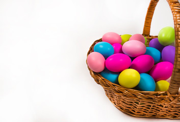 Colorful easter eggs in basket
