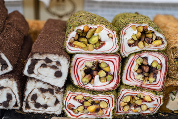 Various types or many colorful assortment of Turkish delights rolls for sale in a shop in Istanbul