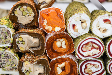 Various types or many colorful assortment of Turkish delights rolls for sale in a shop in Istanbul