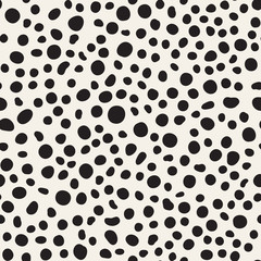 Vector texture with random spots. Seamless dotted pattern.