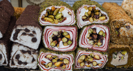 Various types or many colorful assortment of Turkish delights rolls for sale in a shop in Istanbul