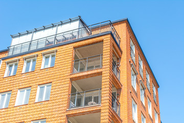 Fototapeta na wymiar Modern Luxury Scandinavia Apartment Building wiith Blue Sky in Home Residential Area