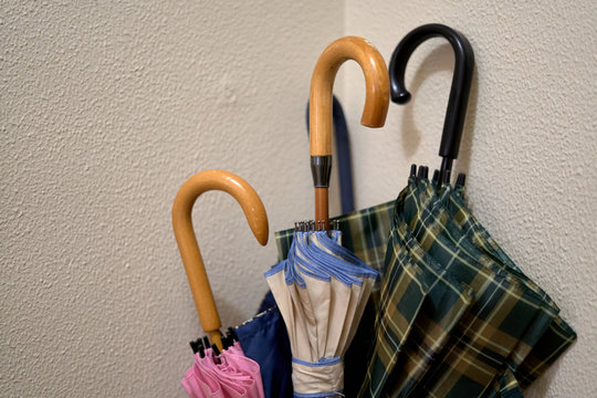 colorful umbrella with sand yellow background