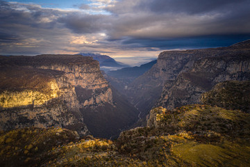 Aerial view of Vikos Gorge, a gorge in the Pindus Mountains of northern Greece at sunset time