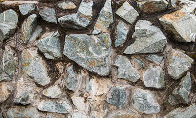 a certain number of small and large stones of different colors, connected to each other