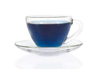 Glass of butterfly pea juice on white background, herb and medical concept