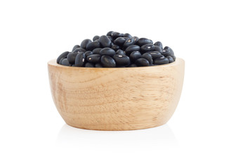 Fototapeta na wymiar Closeup black beans seeds in wooden bowl on white background, healthy food concept