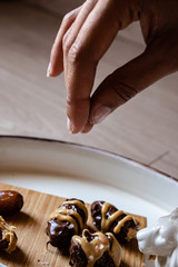 Hand sprinkle salt on food