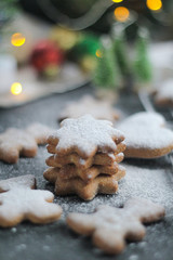 Christmas new year background with gingerbread and powdered sugar diet food diet coocies with ginger