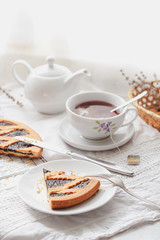 Fruit berry pie and fresh tea on white background