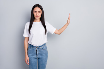 Portrait of nice attractive lovely pretty strict content straight-haired girl showing stop sign...