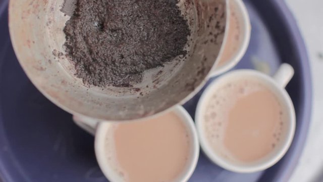 The Making Of Spiced Chai Tea In A Traditional Village.
