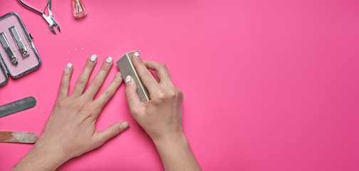 Overgrown nails with an old cracked gel polish. Self-removal of old gel polish from nails with a...