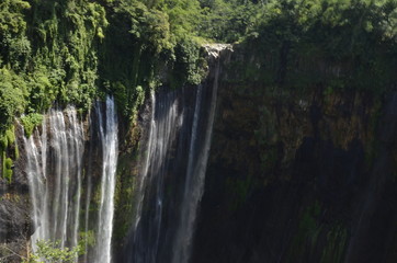 Naklejka premium Beautiful autumn landscape waterfall in indonesia
