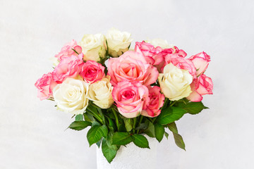Beautiful pink and white roses in vase. Copy space, Holiday background. Mother's day, Valentines Day, Birthday celebration concept.