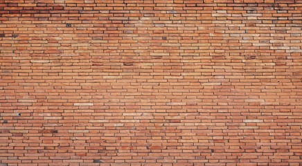 The background of the brick wall with dark orange is beautifully arranged. Ancient wall Grunge background The backdrop may be used in interior design.