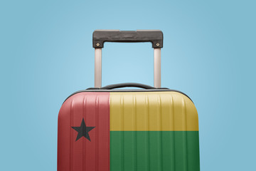 Baggage with Guinea-Bissau flag print tourism and vacation concept.