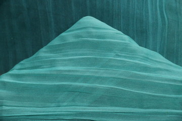 fondo abstracto con texturas textiles en color verde azulado